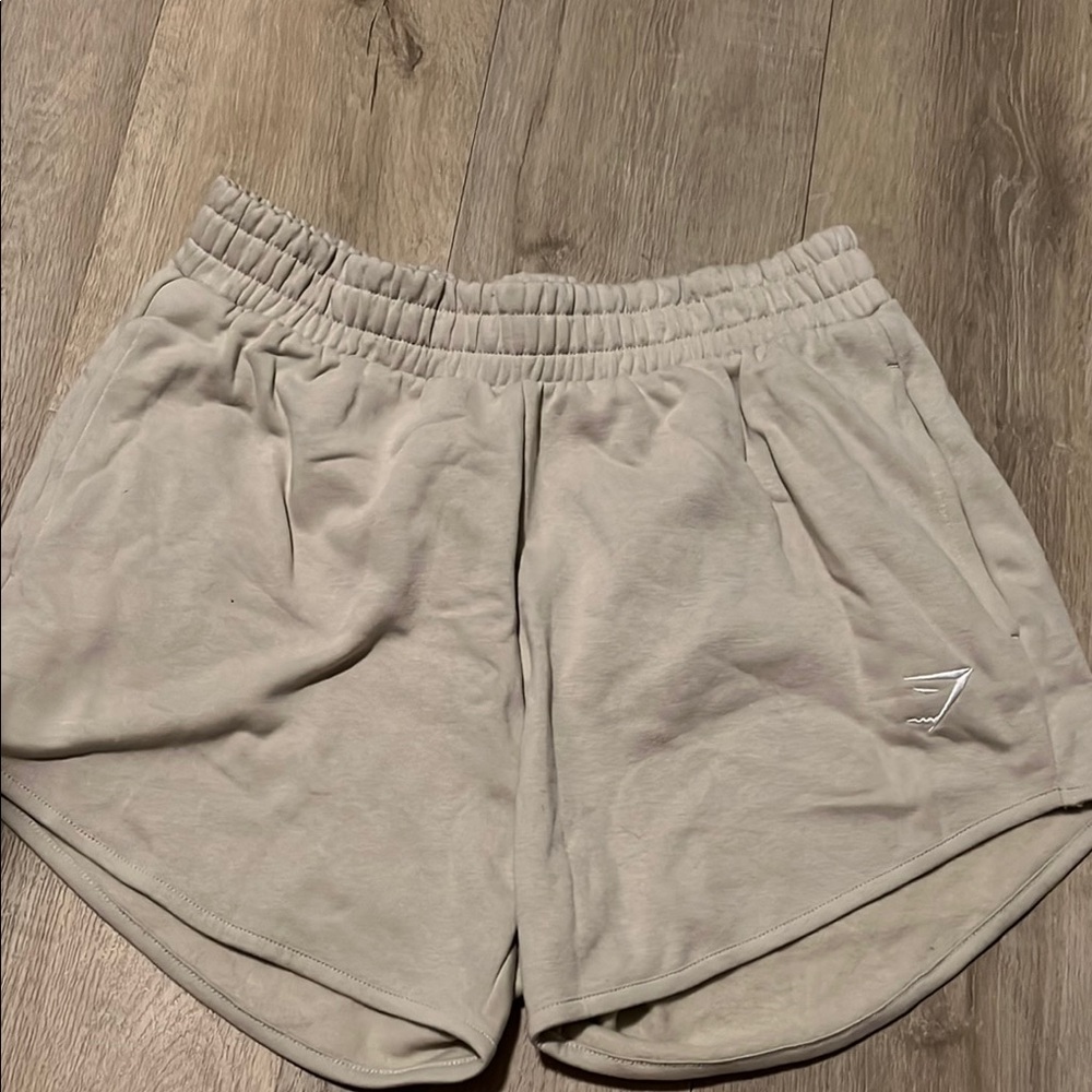 Tan Athletic Shorts with Elastic Waistband and Dolphin Hem